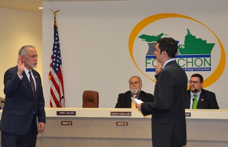 PHOTO: Mr. Charles Michael “Mike” Callais is sworn in as interim Port Commissioner for Seat E by Legal Counsel Bryce Autin while Board President Perry Gisclair (L) and Executive Director Chett Chiasson (R) look on.