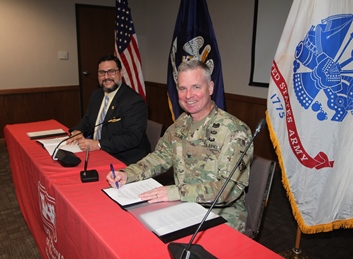 PHOTO: GLPC's Chett Chiasson and USACE Col. Michael Clancy signing assumption of maintenance agreement